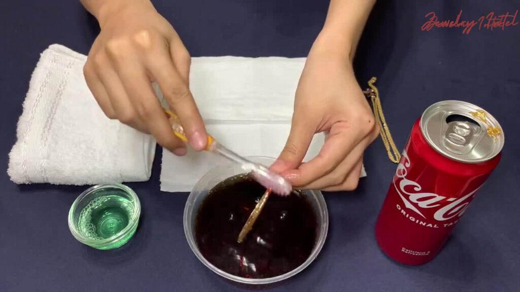 scrub gold with a brush