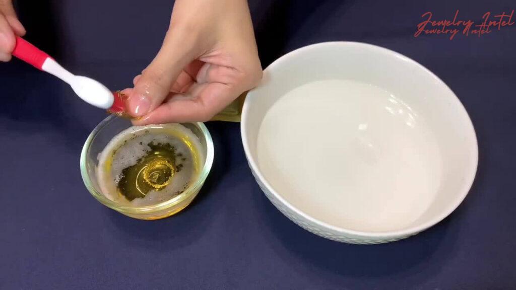 scrub gold with brush