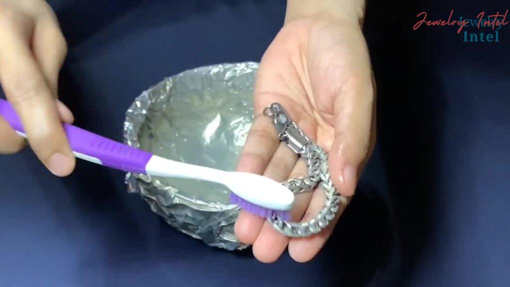 scrub silver with a brush