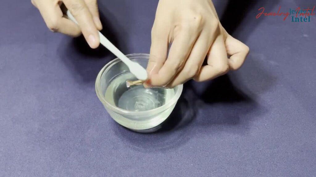 scrub the diamond ring gently with a brush