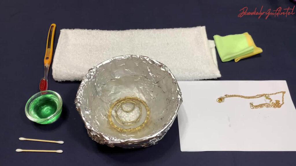 soak gold-plated jewelry in baking soda solution